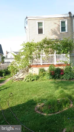 a view of a house with a yard and plants