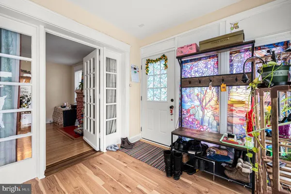 a bedroom with furniture and flat screen tv