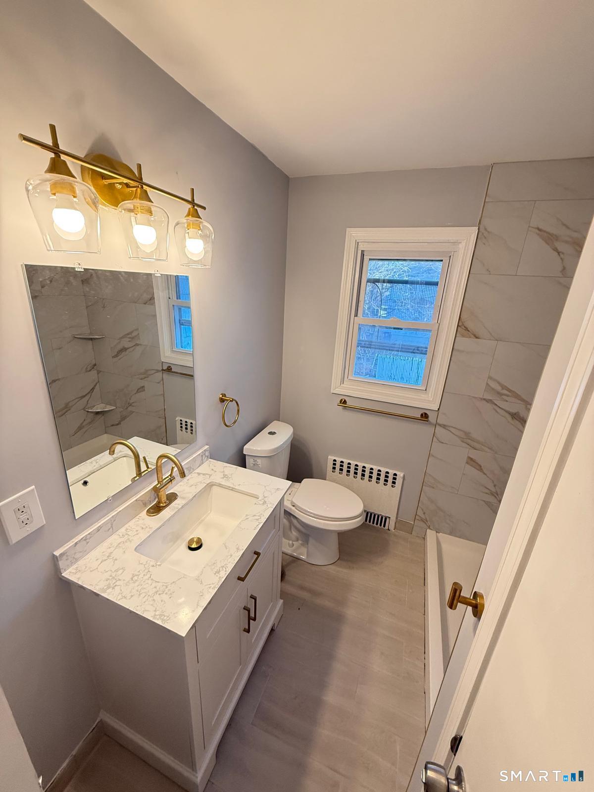 524 Garfield Avenue, Unit 2 Bridgeport, CT 06606 - Photo 8 of 10 a utility room with dryer and washer