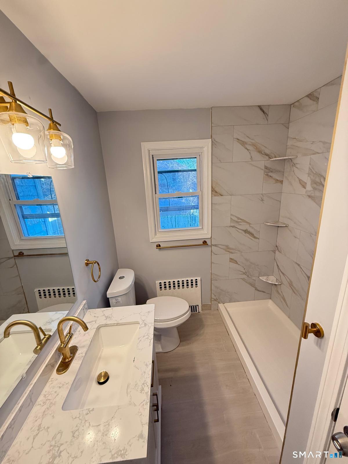 524 Garfield Avenue, Unit 2 Bridgeport, CT 06606 - Photo 10 of 10 a bathroom with a sink and a bathtub
