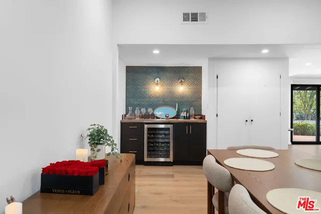 a bedroom with a bed and a mirror