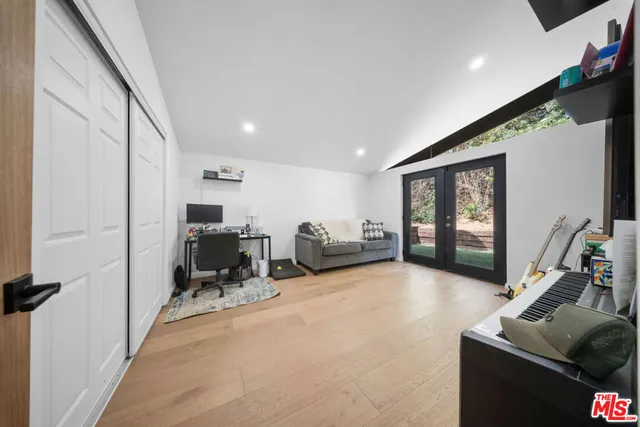 a bathroom with a toilet a sink and a mirror