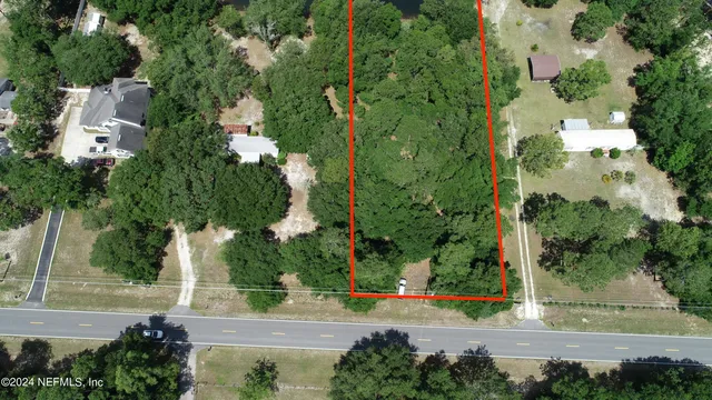 a view of a lake with a yard