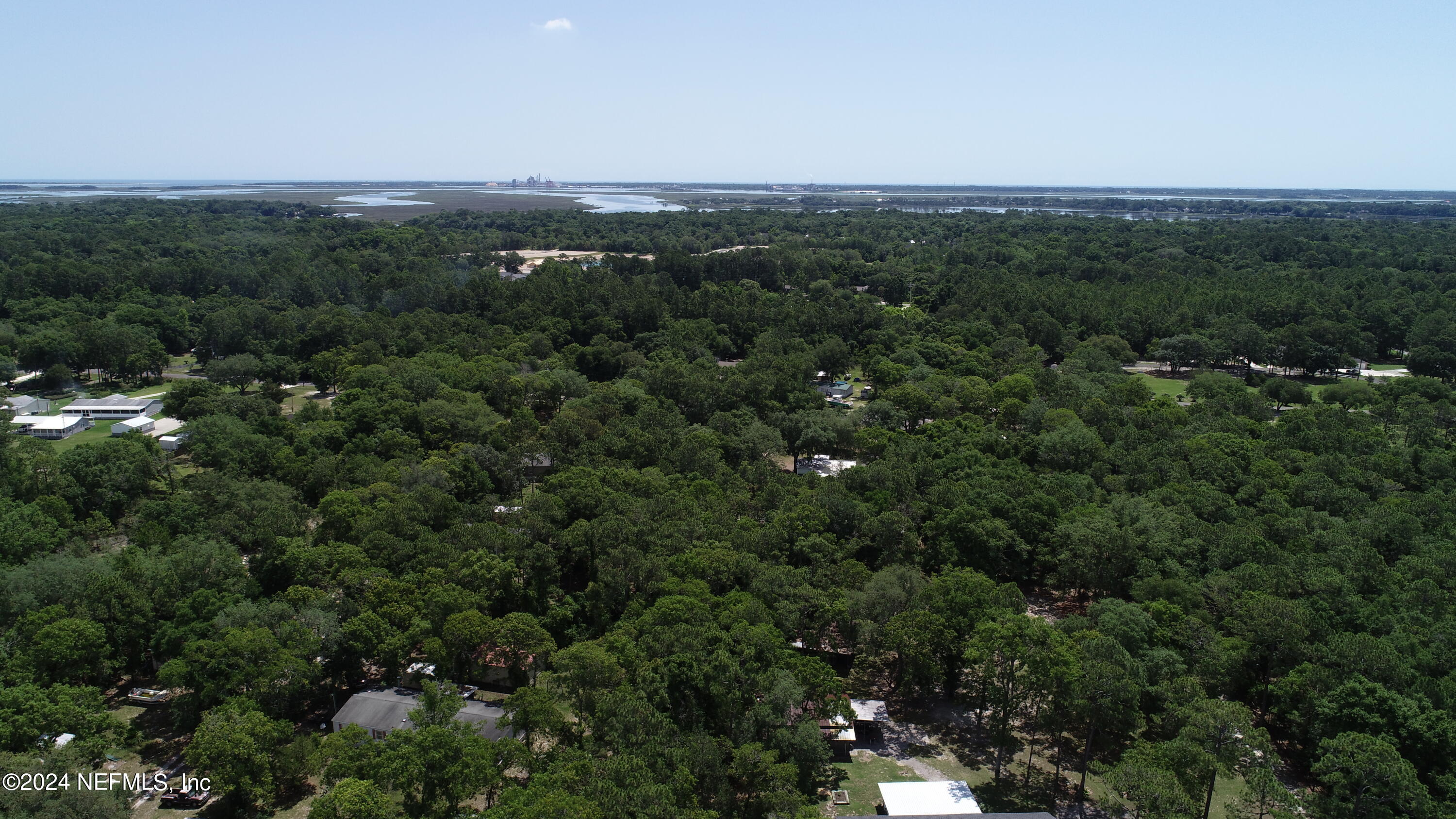 0 Chester Road Yulee, FL 32097 - Photo 7 of 12 a view of a city with lush green forest