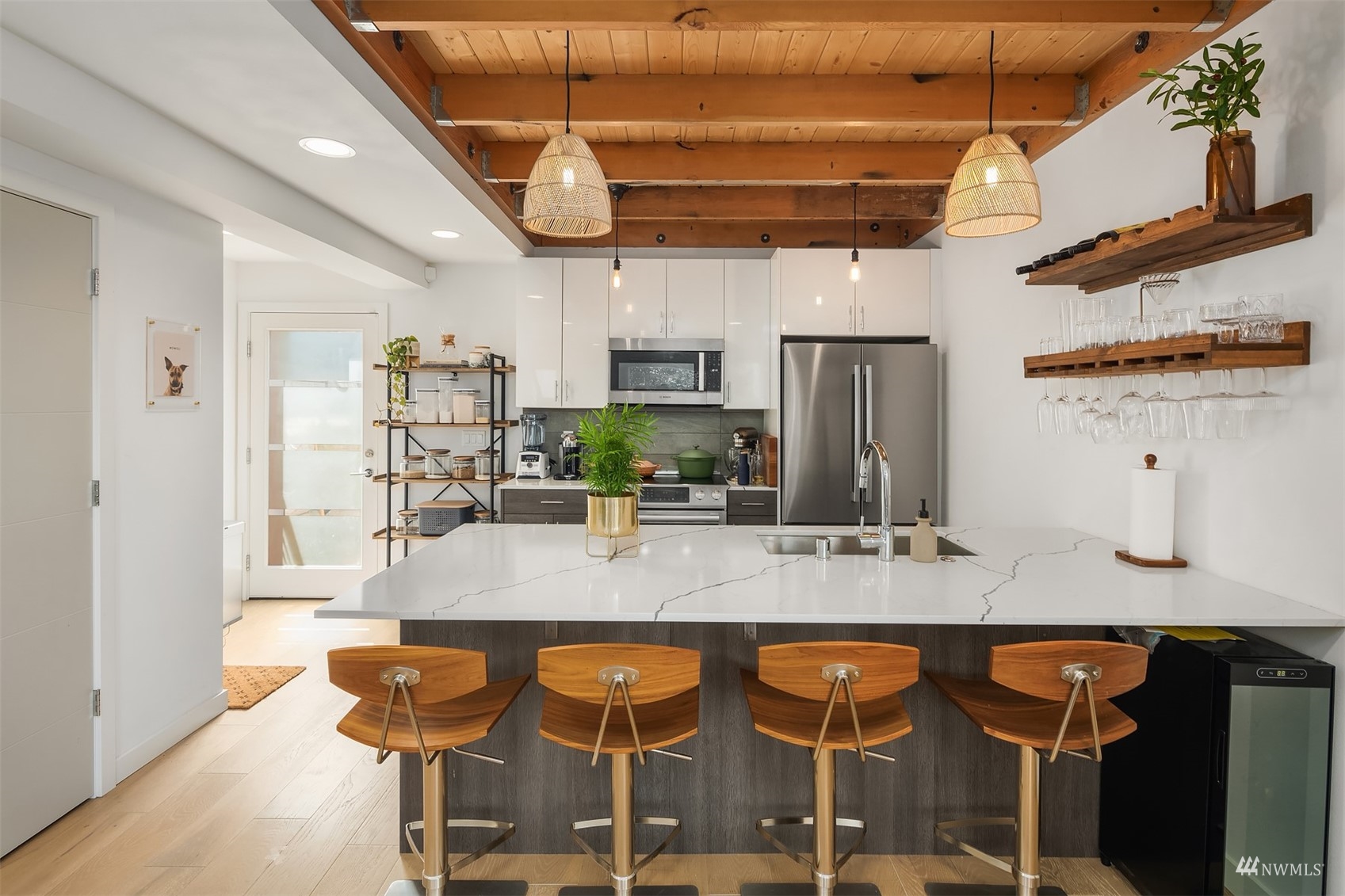 4209 Southwest Frontenac Street Seattle, WA 98136 - Photo 11 of 36 a kitchen with stainless steel appliances granite countertop a sink and cabinets