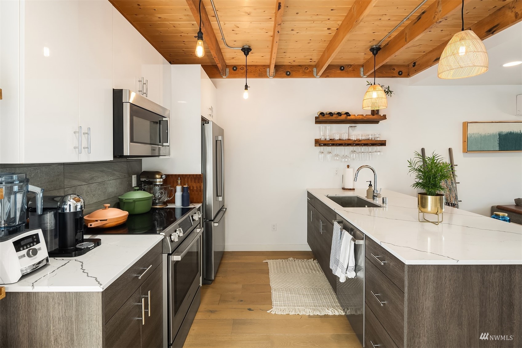 4209 Southwest Frontenac Street Seattle, WA 98136 - Photo 12 of 36 a kitchen with a sink stove and refrigerator