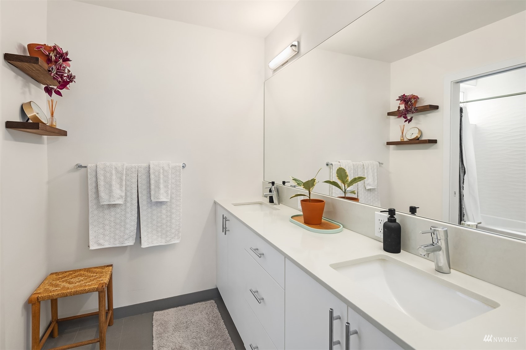 4209 Southwest Frontenac Street Seattle, WA 98136 - Photo 19 of 36 a bathroom with a sink and a mirror