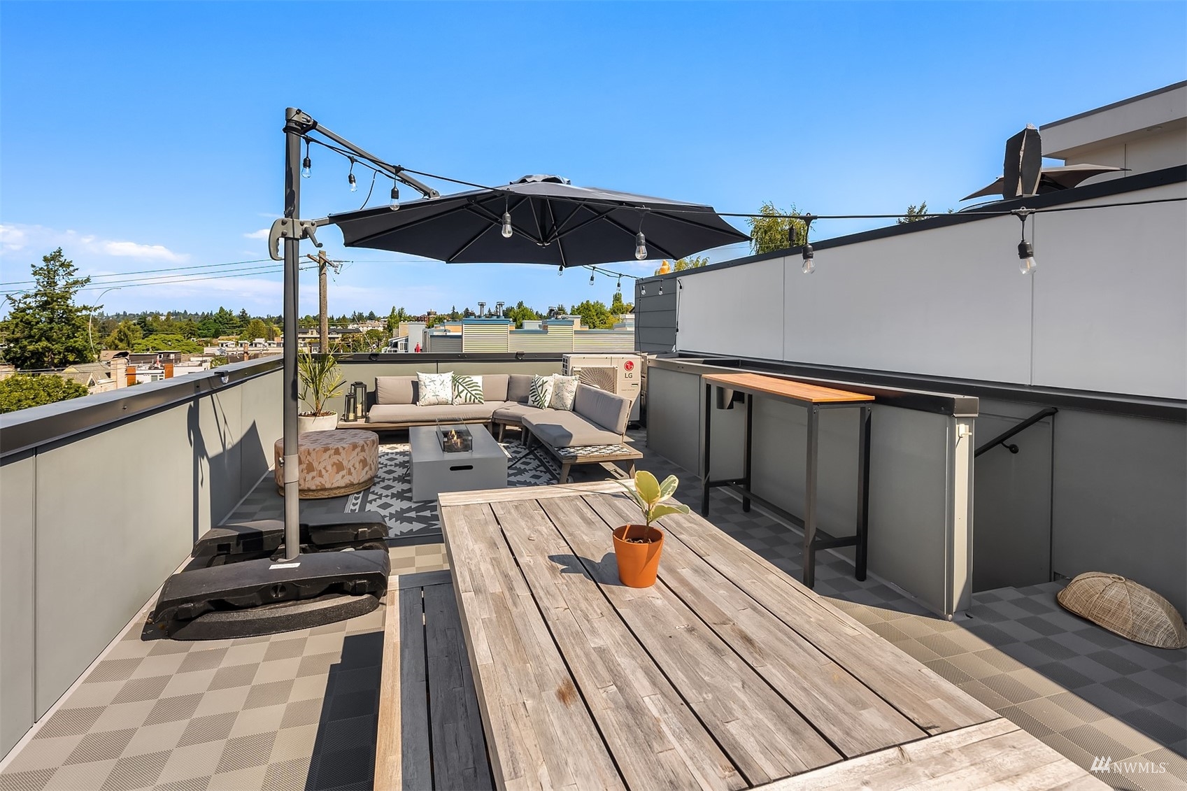 4209 Southwest Frontenac Street Seattle, WA 98136 - Photo 30 of 36 a view of balcony with wooden floor and outdoor seating
