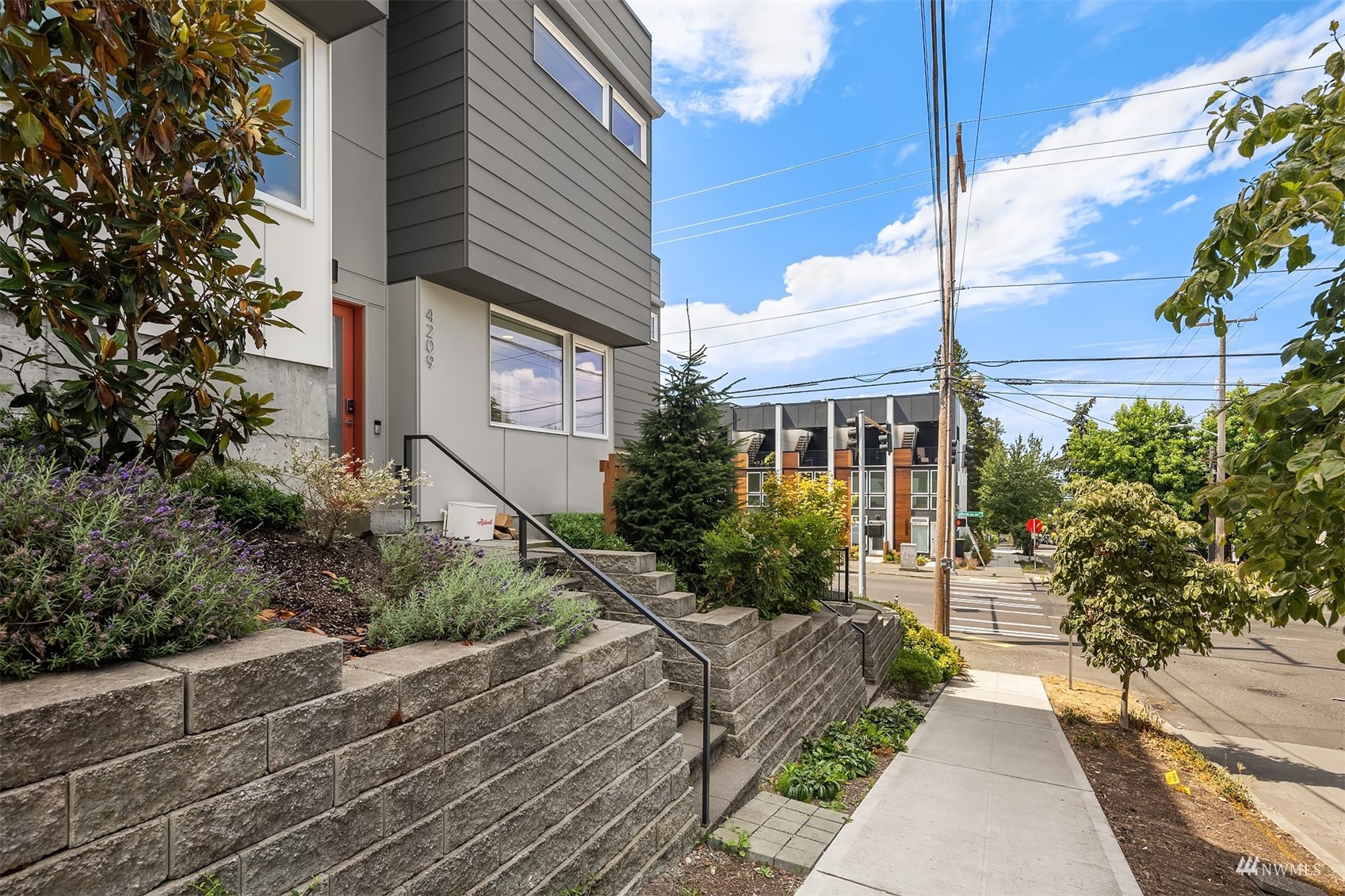 4209 Southwest Frontenac Street Seattle, WA 98136 - Photo 35 of 36 a view of a brick house with a yard