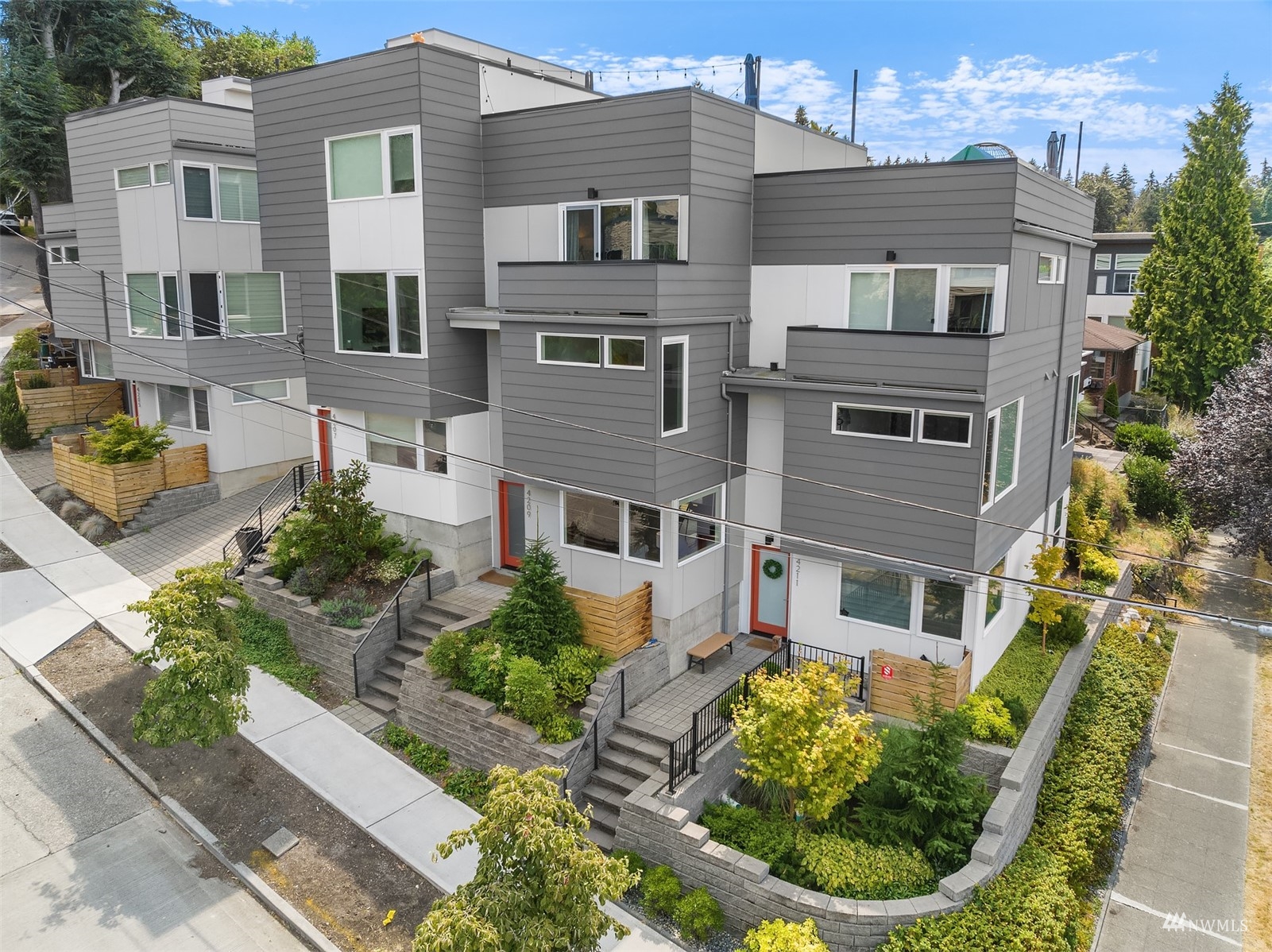 4209 Southwest Frontenac Street Seattle, WA 98136 - Photo 6 of 36 a front view of a house with a yard