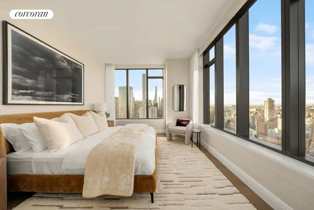 a kitchen with a sink cabinets and wooden floor