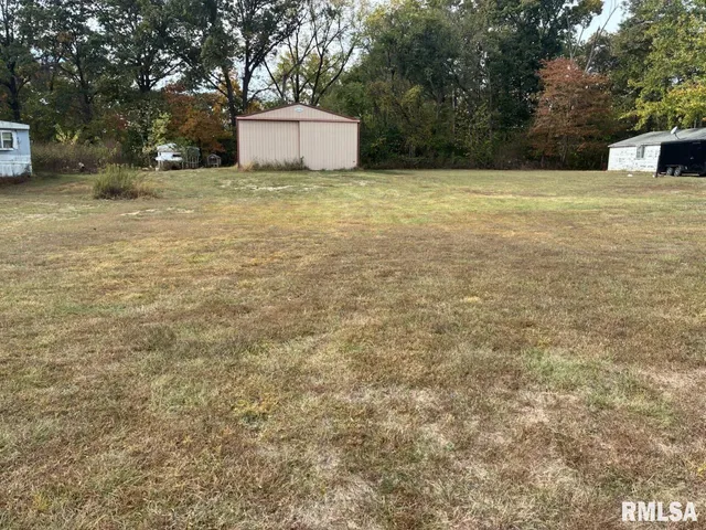a fire hydrant in the middle of a field