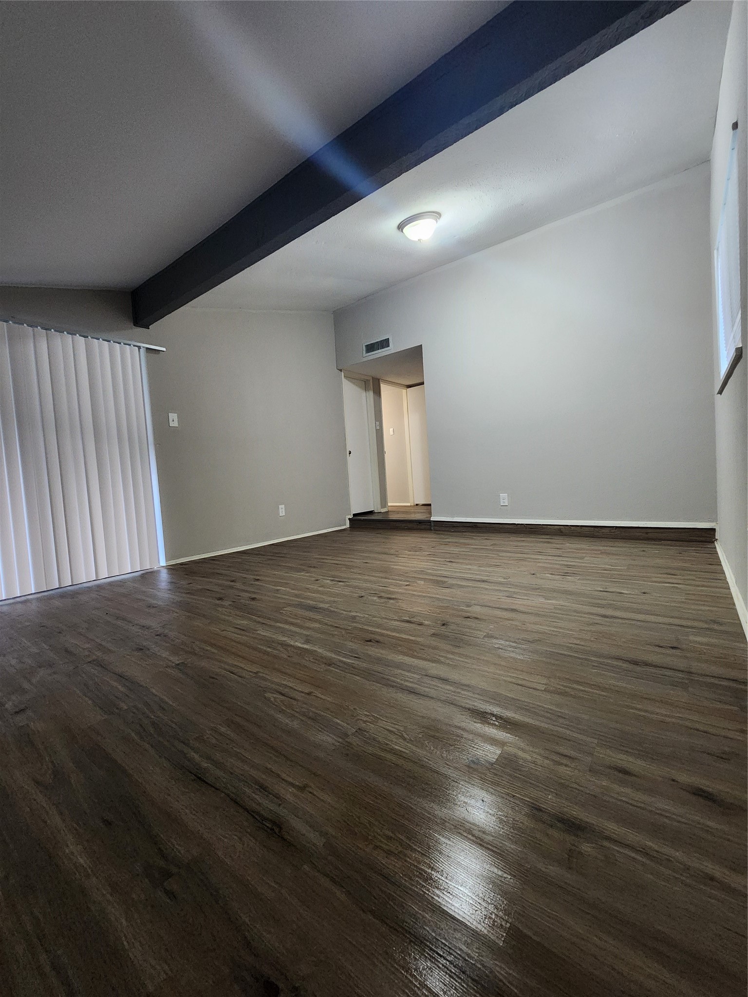 3822 Broken Elm Drive Spring, TX 77388 - Photo 23 of 25 a view of an empty room with wooden floor and a window