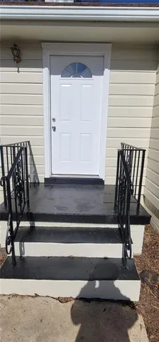 a view of entryway with wooden floor