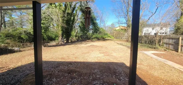 a view of a backyard of the house