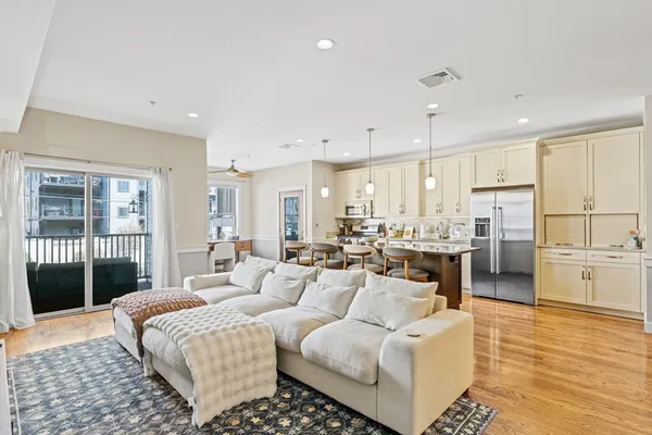 a large room with a large window and furniture