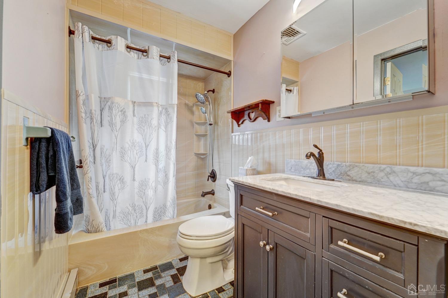 23 Hillside Terrace Andover, NJ 07821 - Photo 12 of 20 a bathroom with a granite countertop sink toilet and shower
