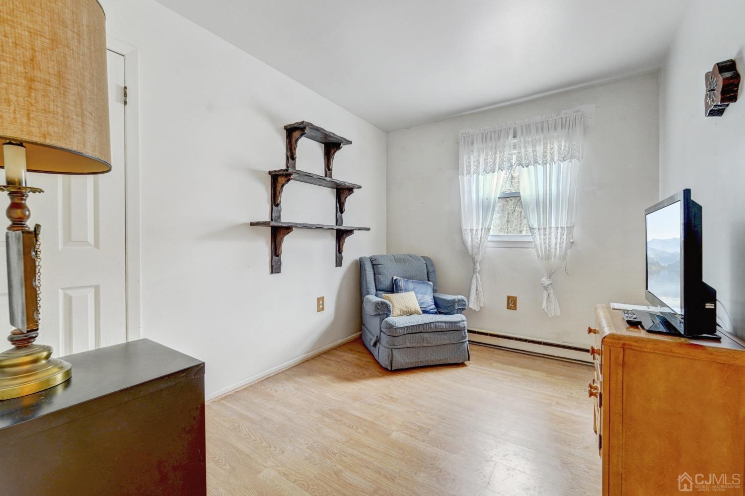 23 Hillside Terrace Andover, NJ 07821 - Photo 13 of 20 a living room with furniture and a flat screen tv