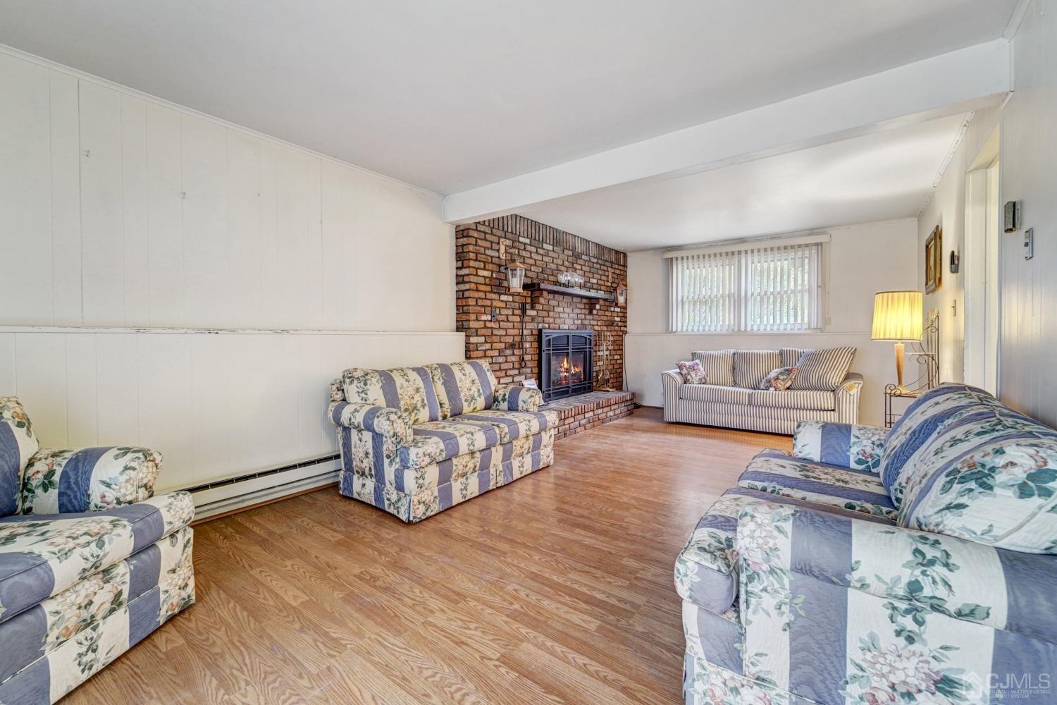 23 Hillside Terrace Andover, NJ 07821 - Photo 14 of 20 a living room with furniture and a fireplace