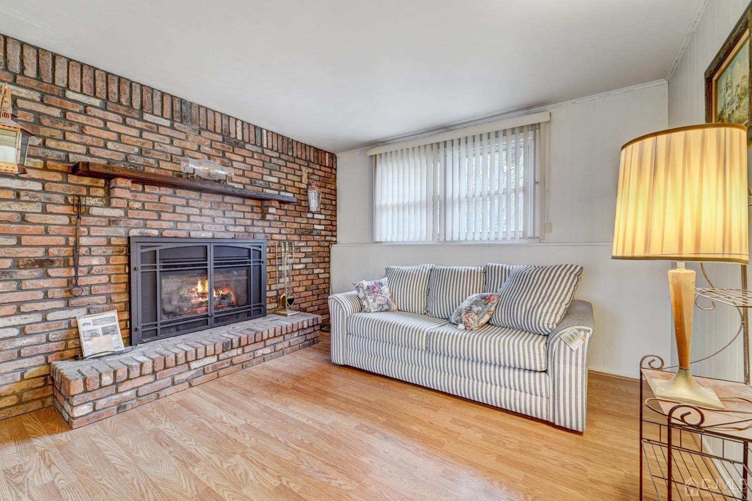 23 Hillside Terrace Andover, NJ 07821 - Photo 15 of 20 a living room with furniture and a fireplace