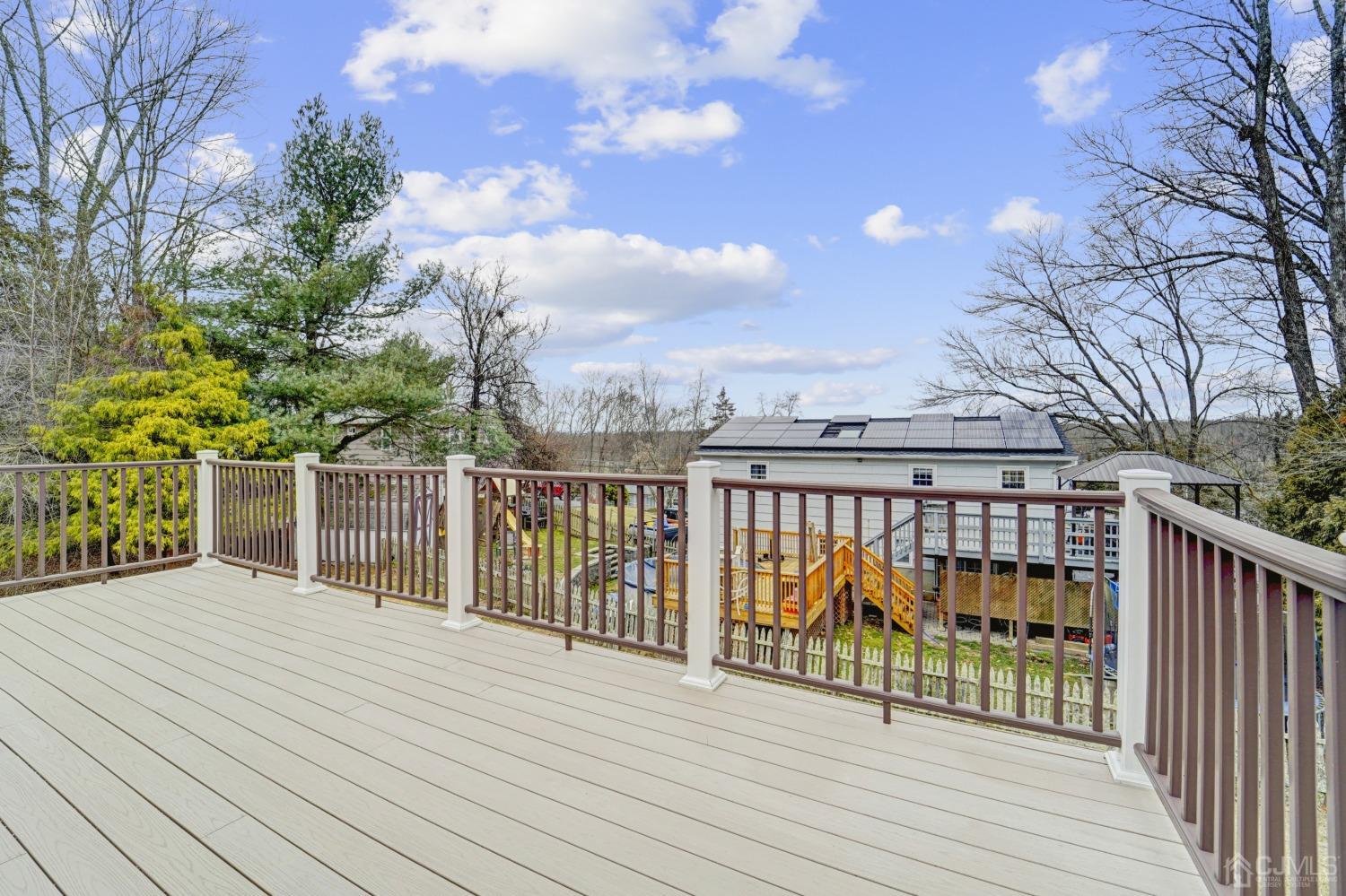 23 Hillside Terrace Andover, NJ 07821 - Photo 18 of 20 a view of a balcony with wooden floor and fence