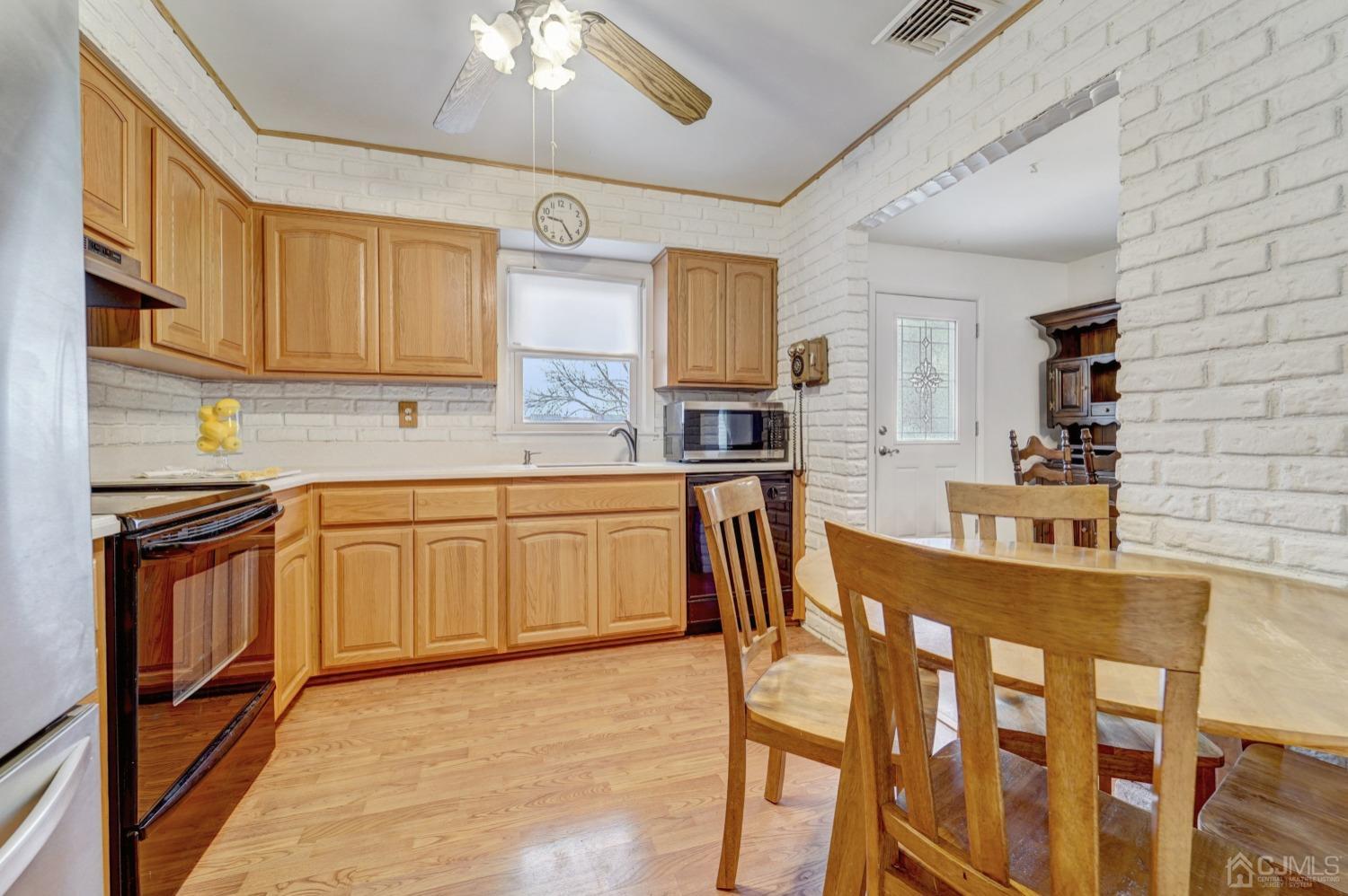 23 Hillside Terrace Andover, NJ 07821 - Photo 4 of 20 a kitchen with stainless steel appliances kitchen island granite countertop a table chairs sink and cabinets