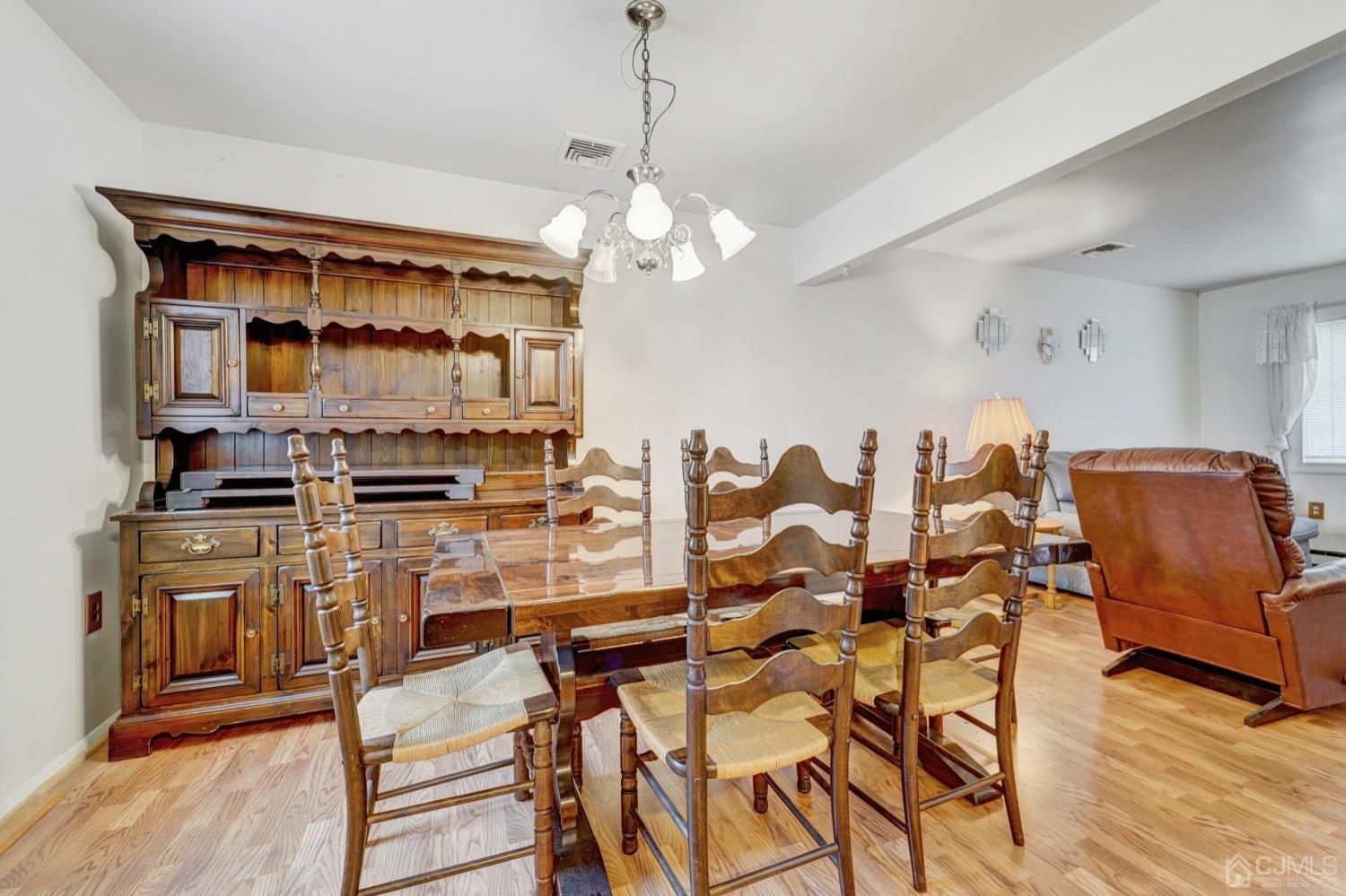 23 Hillside Terrace Andover, NJ 07821 - Photo 8 of 20 a view of a dining room with furniture and wooden floor