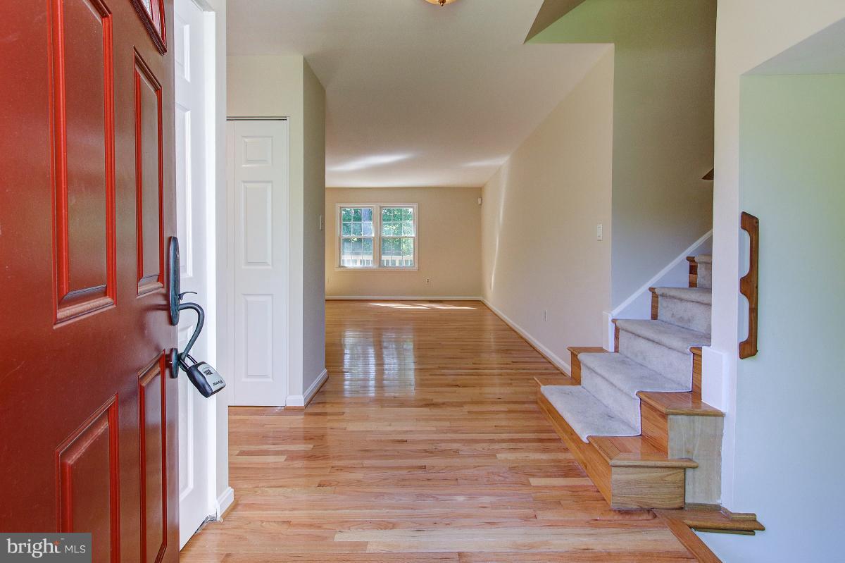 12301 Coleraine Court Reston, VA 20191 - Photo 3 of 29 a view of entryway and hall with wooden floor