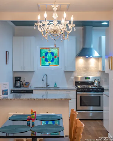 a kitchen with a stove and cabinets