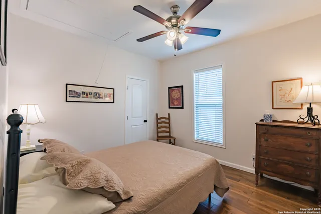 a bedroom with a bed and a desk