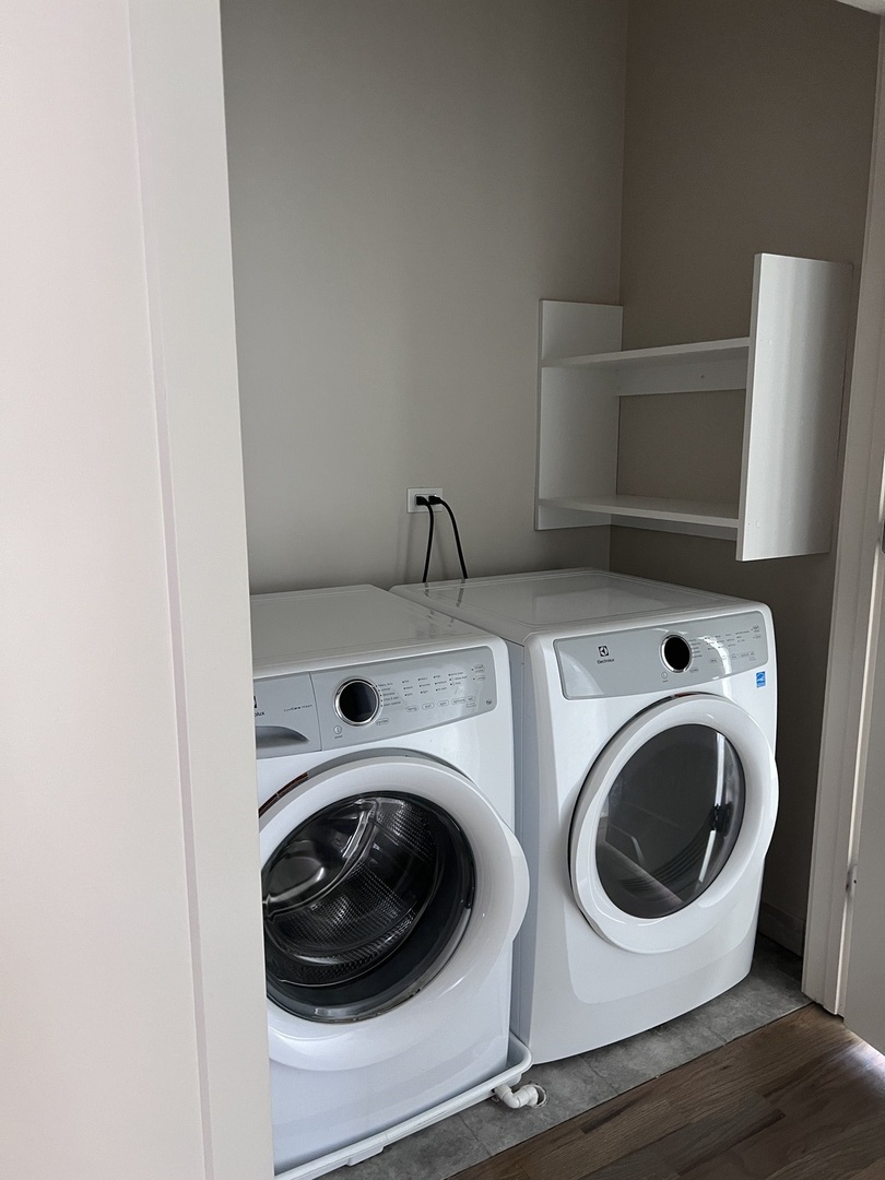 1208 East 64th Street, Unit 2B Chicago, IL 60637 - Photo 11 of 19 a utility room with dryer and washer