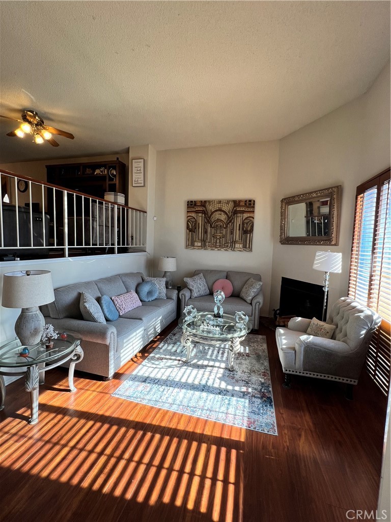 19230 Wyandotte Street, Unit 14 Reseda, CA 91335 - Photo 6 of 10 a living room with furniture and a couch