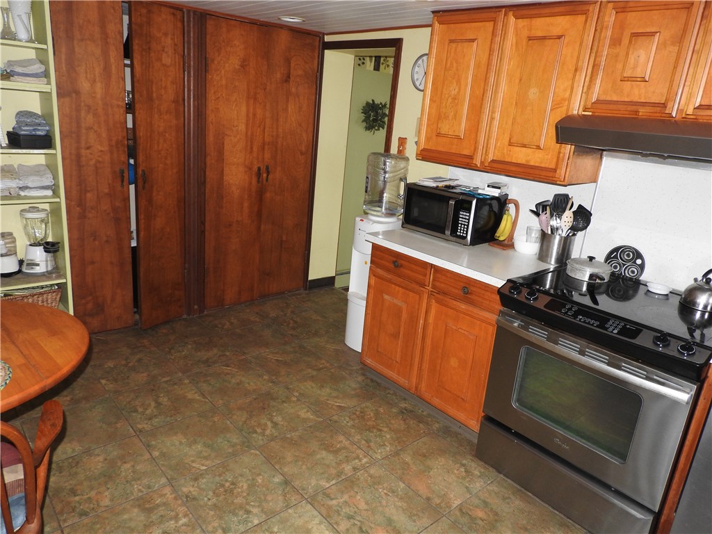 2185 East Loy Road Piqua, OH 45356 - Photo 9 of 19 This functional kitchen provides a warm and inviting atmosphere for daily living.