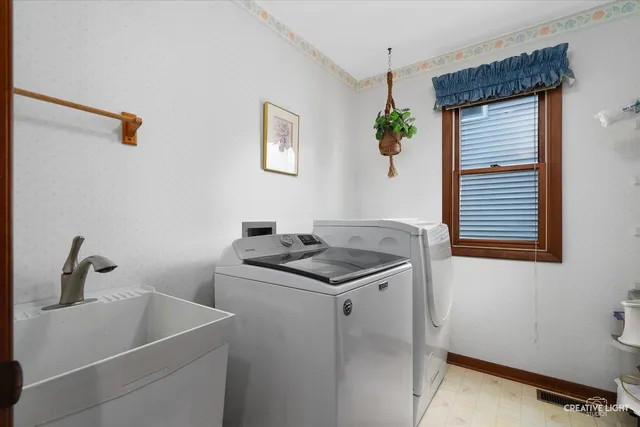 a bathroom with a sink and a window