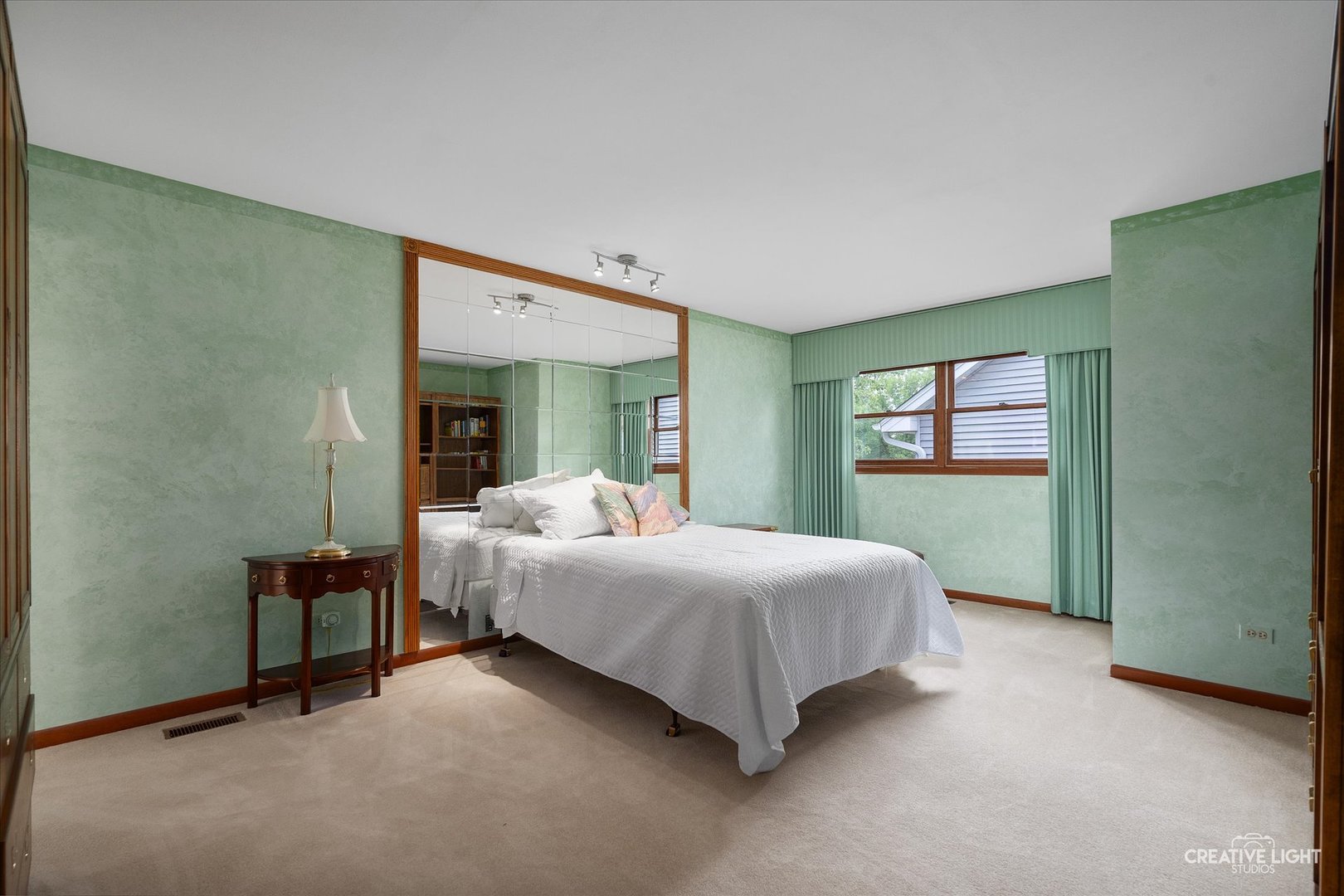 567 Roxbury Drive Naperville, IL 60565 - Photo 18 of 36 a bedroom with a bed and a mirror