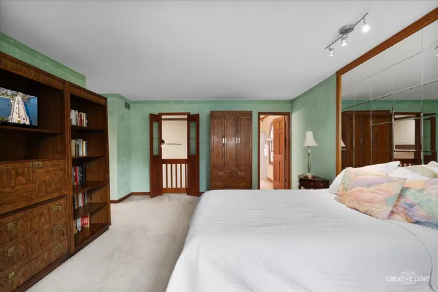 a bedroom with a bed and a cabinets