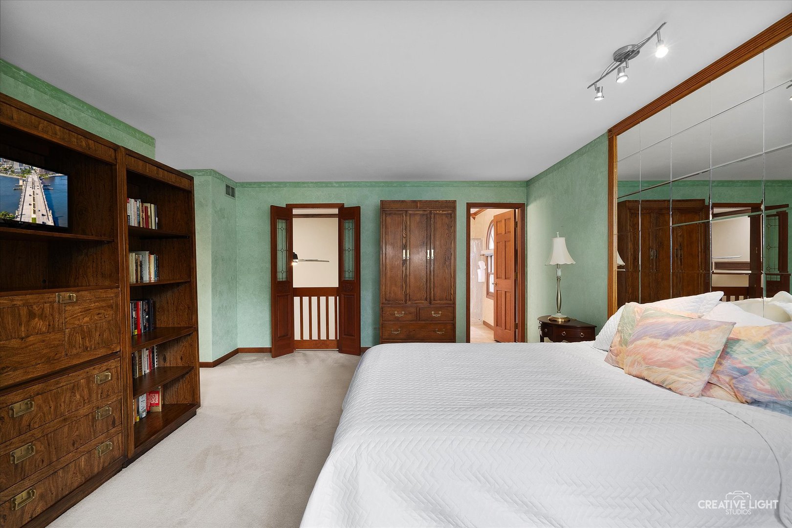 567 Roxbury Drive Naperville, IL 60565 - Photo 19 of 36 a bedroom with a bed and a cabinets