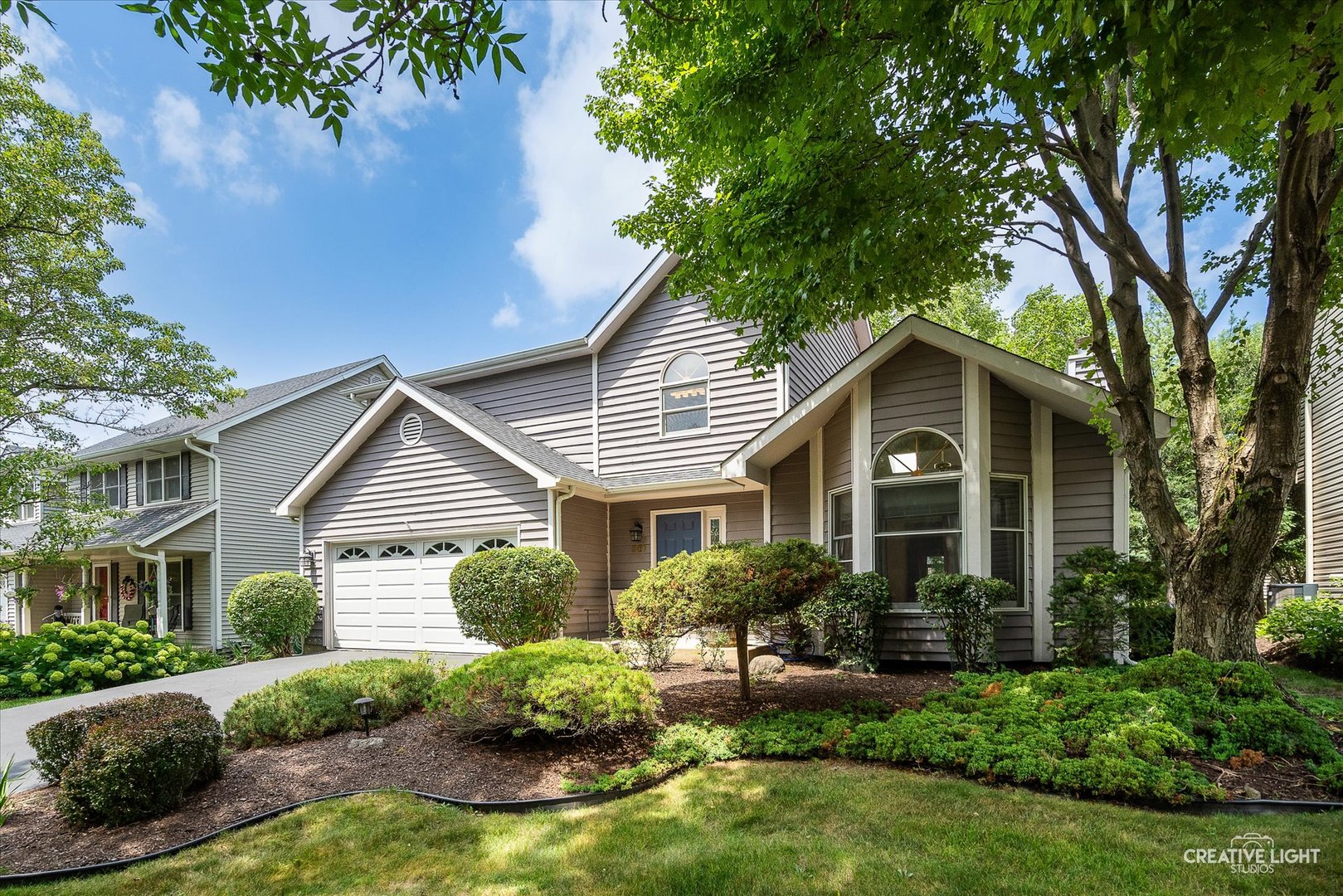 567 Roxbury Drive Naperville, IL 60565 - Photo 3 of 36 a front view of a house with a yard and porch