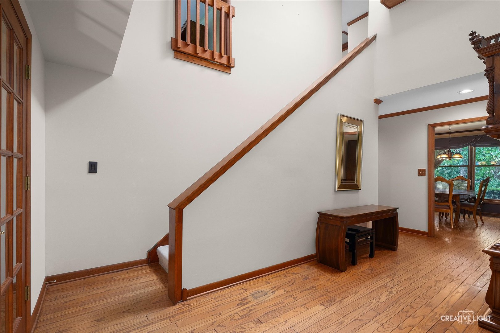 567 Roxbury Drive Naperville, IL 60565 - Photo 9 of 36 a view of an entryway with wooden floor and stairs