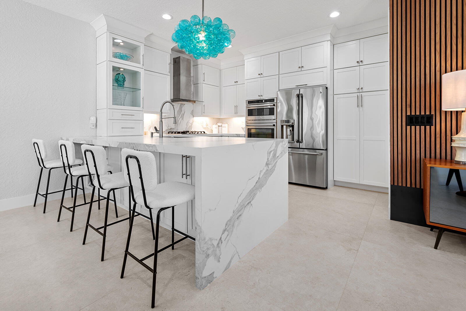 4267 Northwest 65th Place Boca Raton, FL 33496 - Photo 14 of 80 a kitchen with stainless steel appliances a refrigerator and a stove top oven