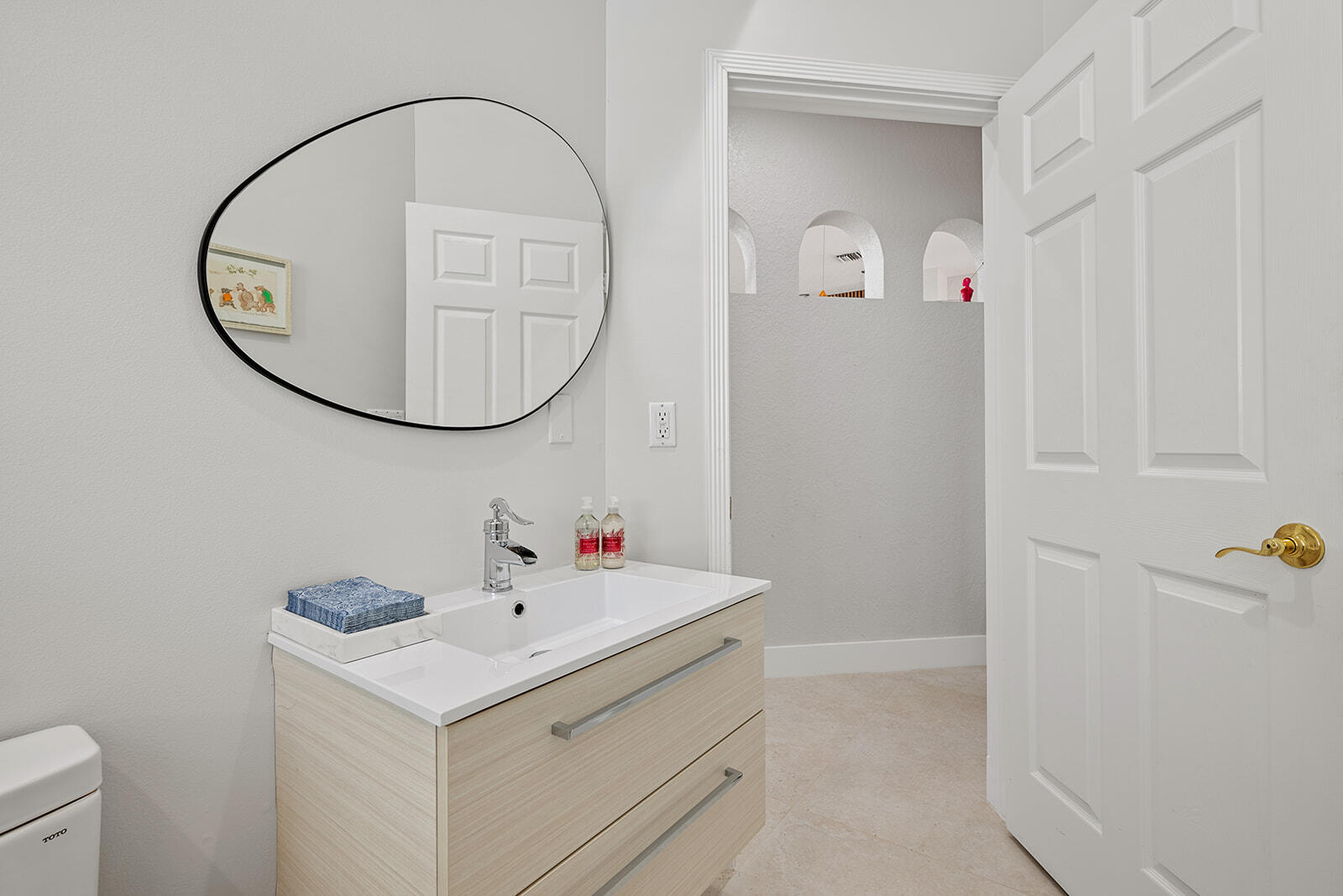 4267 Northwest 65th Place Boca Raton, FL 33496 - Photo 25 of 80 a bathroom with a sink and a mirror