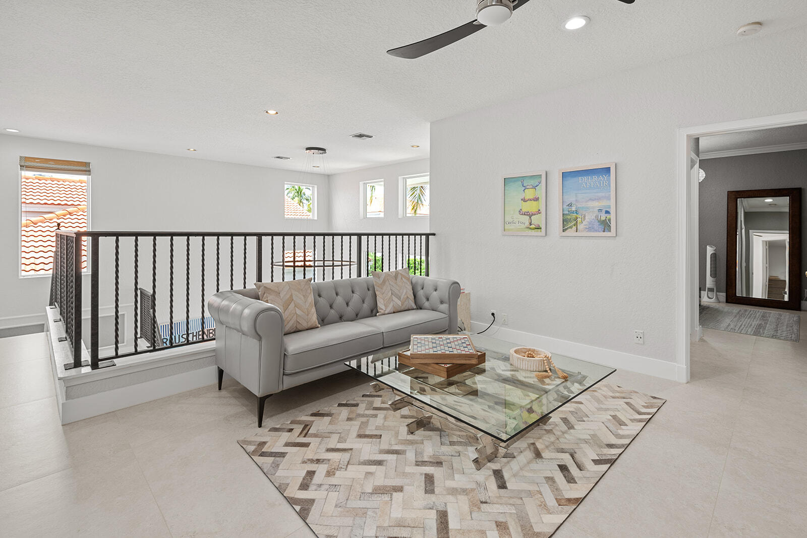 4267 Northwest 65th Place Boca Raton, FL 33496 - Photo 29 of 80 a living room with furniture and a rug
