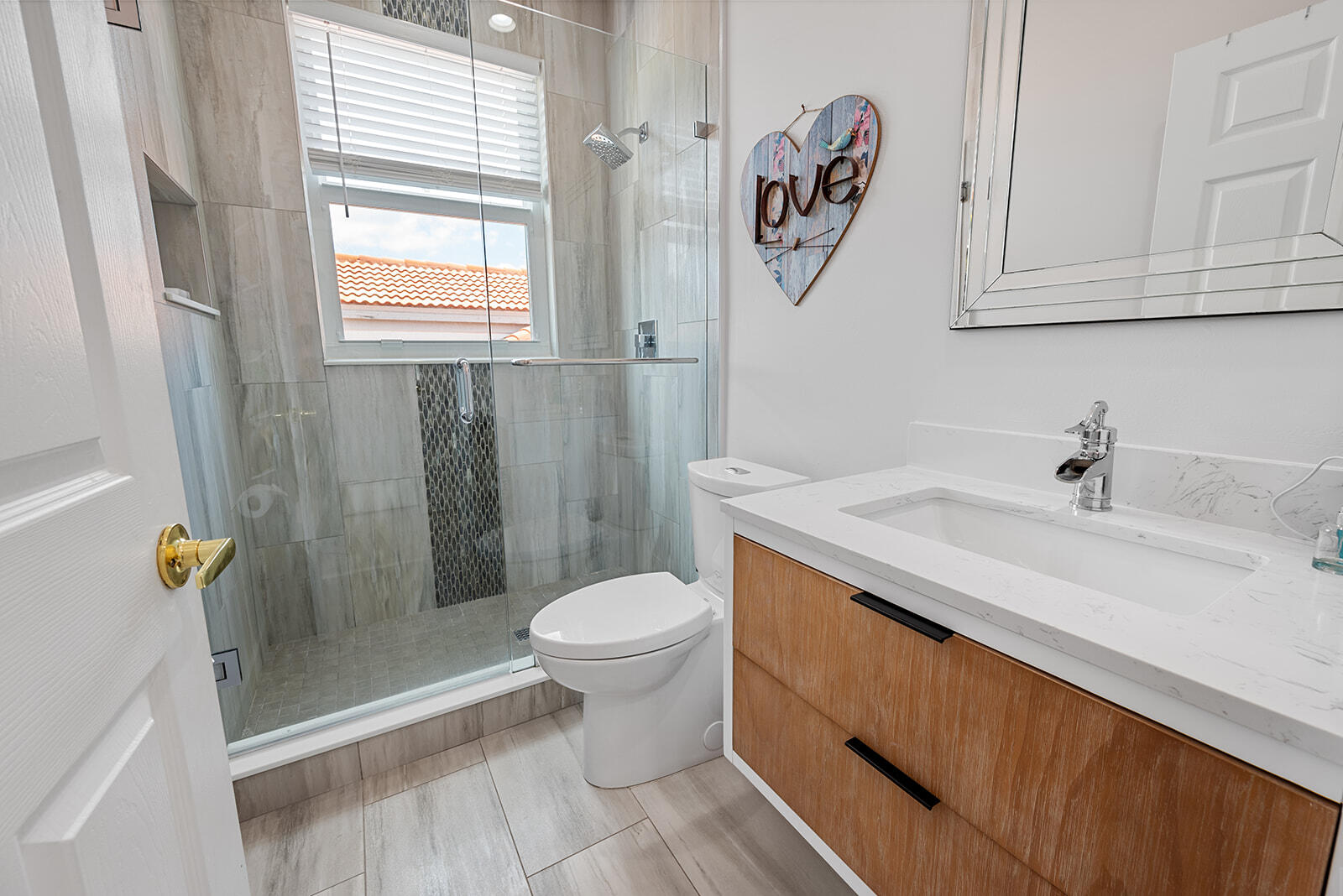 4267 Northwest 65th Place Boca Raton, FL 33496 - Photo 33 of 80 a bathroom with a sink a toilet and shower