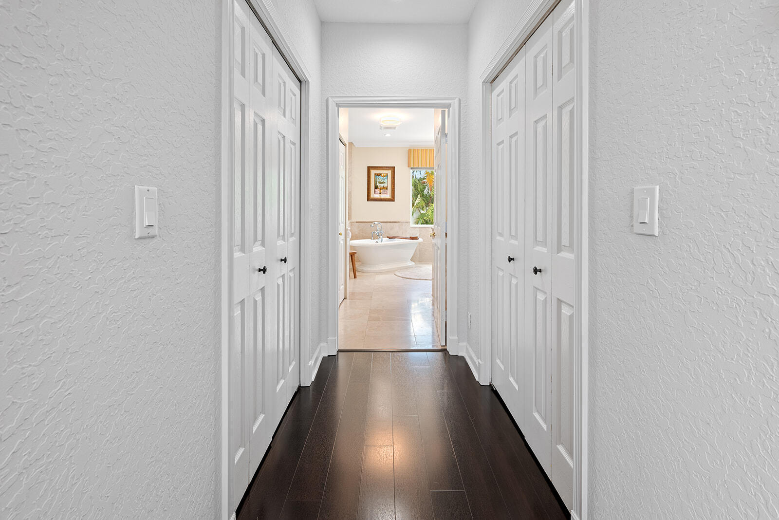 4267 Northwest 65th Place Boca Raton, FL 33496 - Photo 38 of 80 a view of a hallway with wooden floor and a room