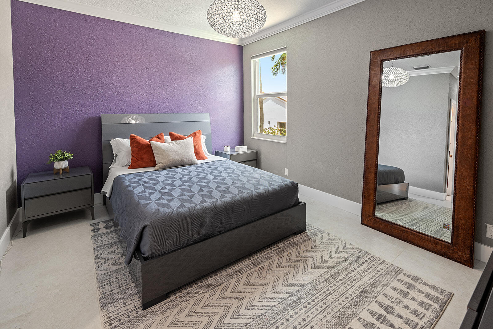 4267 Northwest 65th Place Boca Raton, FL 33496 - Photo 42 of 80 a bedroom with a bed and a mirror