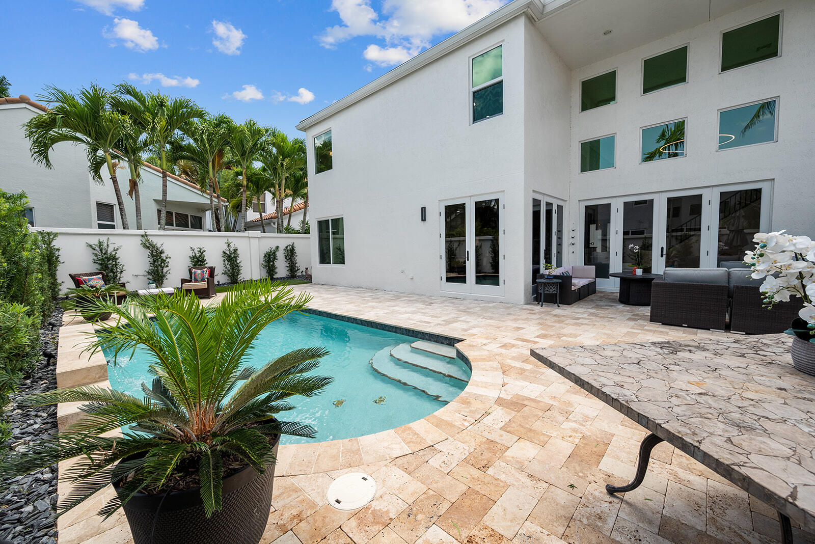 4267 Northwest 65th Place Boca Raton, FL 33496 - Photo 46 of 80 a view of a house with a yard patio and swimming pool