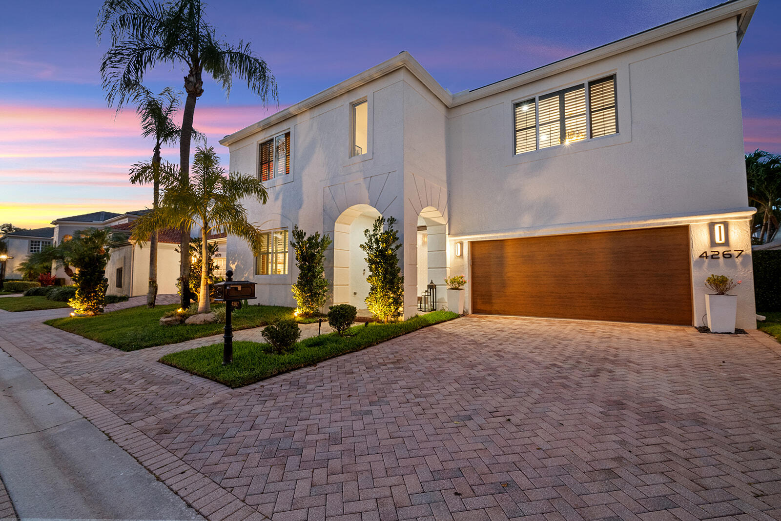 4267 Northwest 65th Place Boca Raton, FL 33496 - Photo 53 of 80 a front view of a house with garden