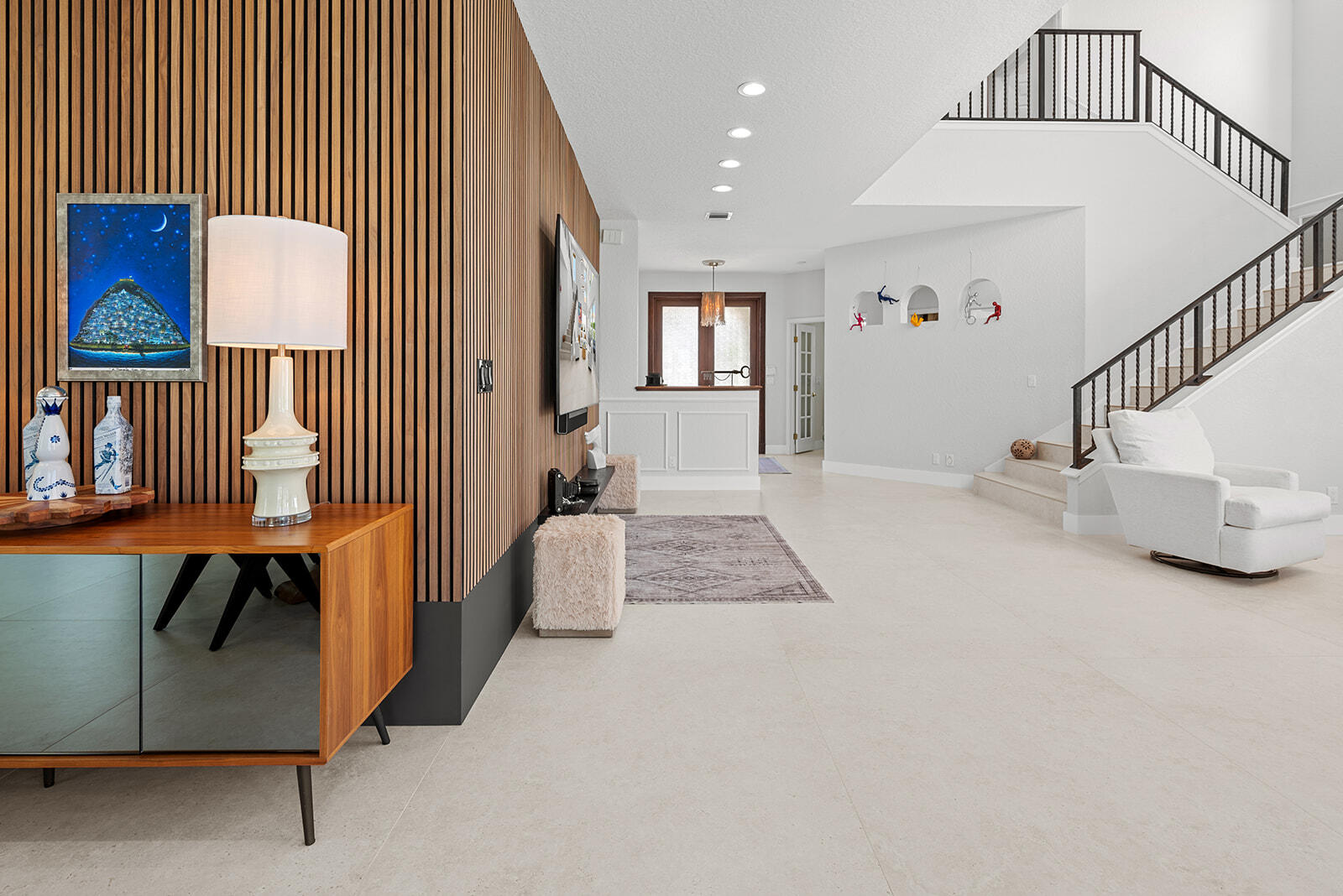 4267 Northwest 65th Place Boca Raton, FL 33496 - Photo 7 of 80 a view of an entryway with wooden floor