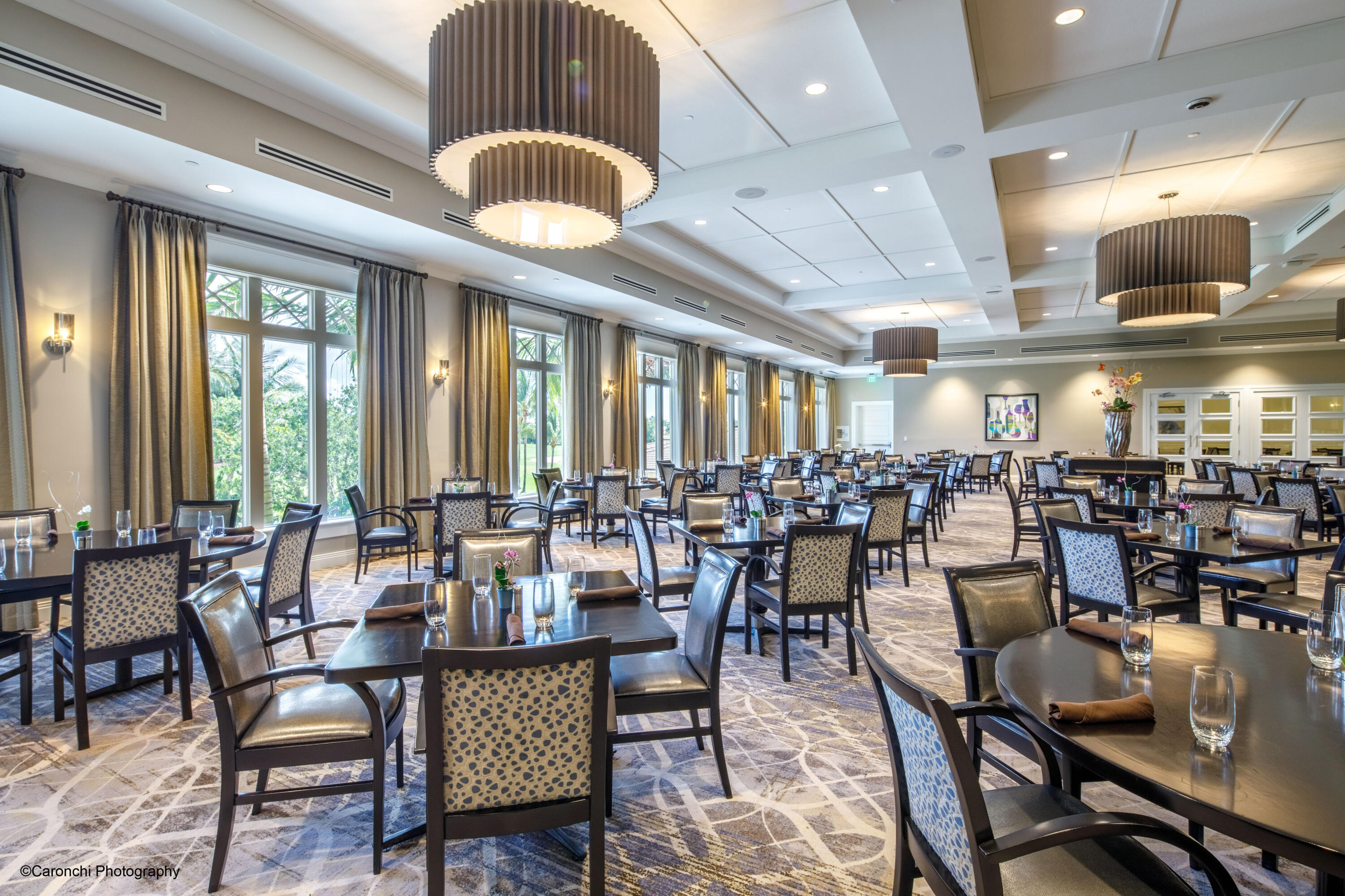 4267 Northwest 65th Place Boca Raton, FL 33496 - Photo 78 of 80 a view of a dining room with furniture and chandelier