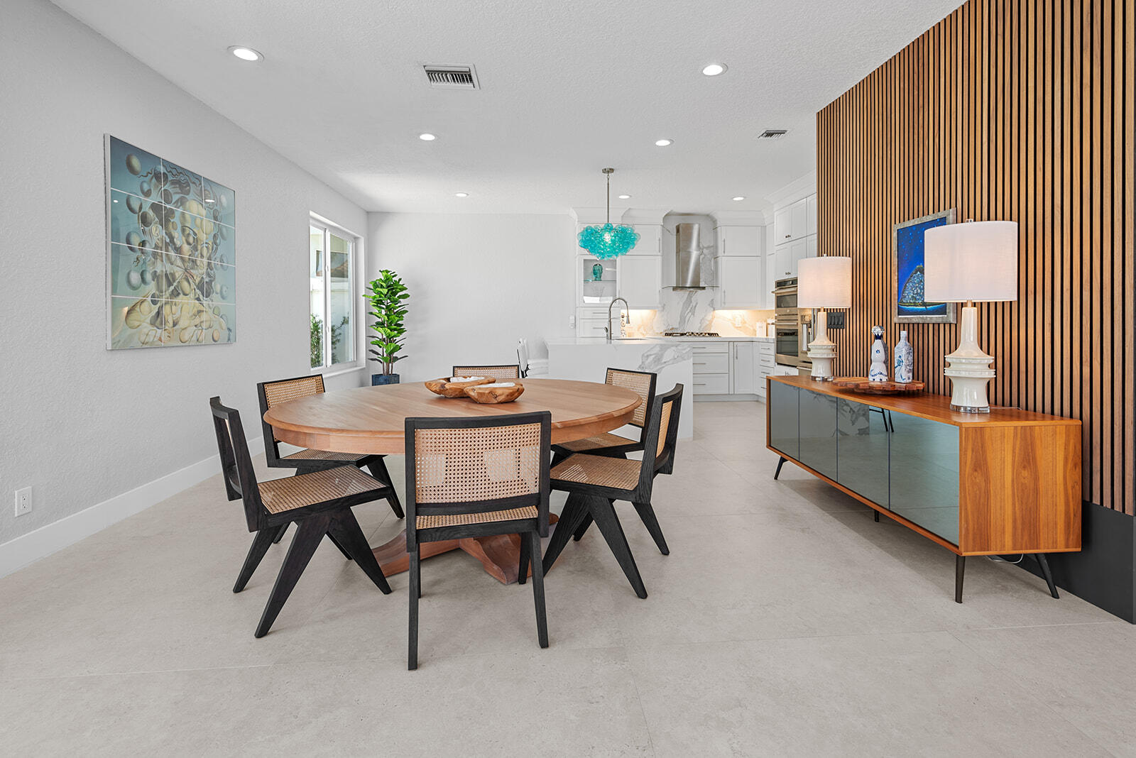 4267 Northwest 65th Place Boca Raton, FL 33496 - Photo 10 of 80 a dining room with furniture and a wooden floor